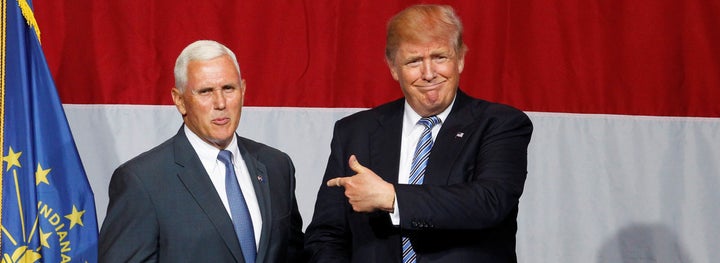 Presumptive GOP presidential candidate Donald Trump points to Indiana Gov. Mike Pence before addressing the crowd during a campaign stop at the Grand Park Events Center in Westfield, Indiana, July 12, 2016.