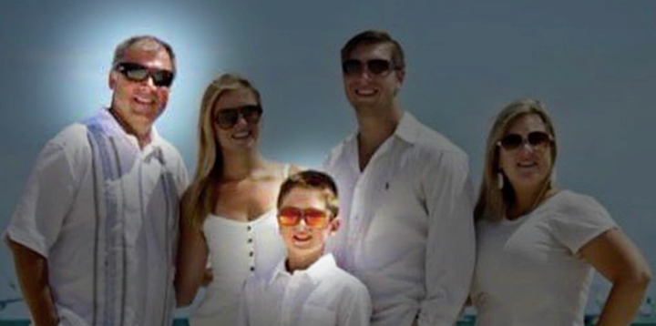 Sean Copeland, at left, and Brodie, center, smile with family members Maegan, Austin, and Sean's wife, Kim, at right.