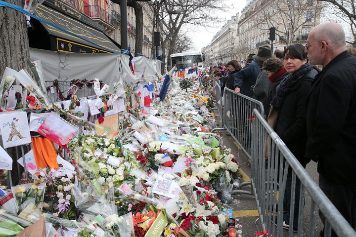 People gather at the Bataclan concert hall on Dec. 13, 2015, to mourn the victims of the attack a month earlier.