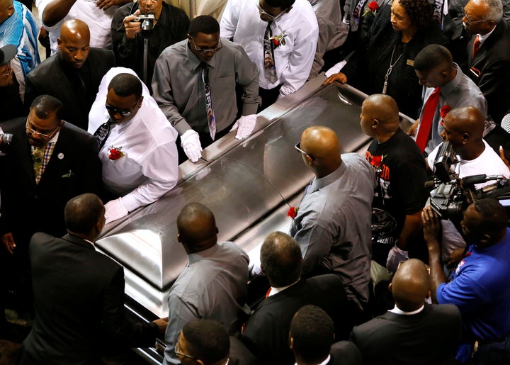 Pallbearers carry the casket of Alton Sterling.