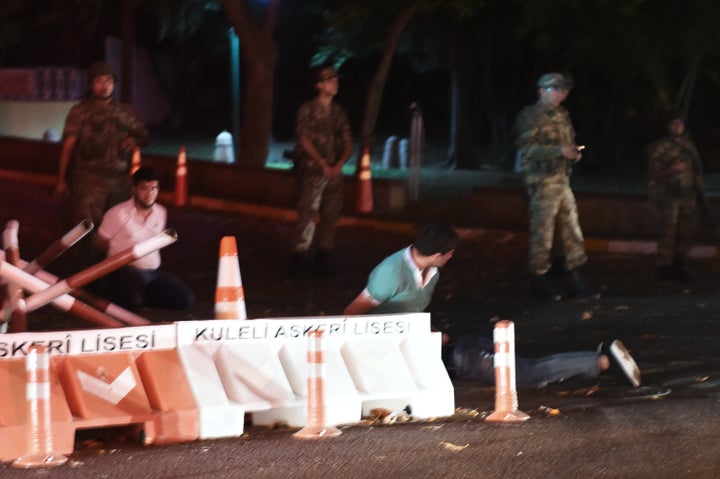 Turkish security officers detain people&nbsp;on the side of the road as they&nbsp;shut down the Bosphorus Bridge in Istanbul.