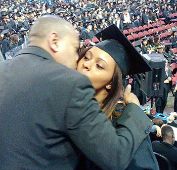 Echavarría hugs his youngest daughter at her college graduation in April. He had missed all her others while he was imprisoned on a wrongful conviction.