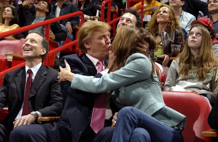 Donald Trump and then-fiancée Melania take part in the Miami Heat 'Kiss Me Cam' tradition in 2004, a year before their marriage.