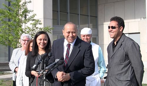 Angel Echavarría (center) addresses reporters and excited supporters outside Essex County Superior Court minutes after his release at the May 18, 2015, bail hearing. He served 21 years in a Massachusetts prison before Judge David A. Lowy overturned his conviction.