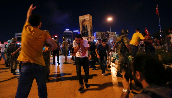 Erdogan supporters are dispersed with shots in the air by the military at Istanbul's Taksim square on Saturday morning.