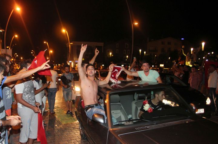 Supporters of Turkish President Tayyip Erdogan in the resort town of Marmaris celebrate after troops involved in the coup sur