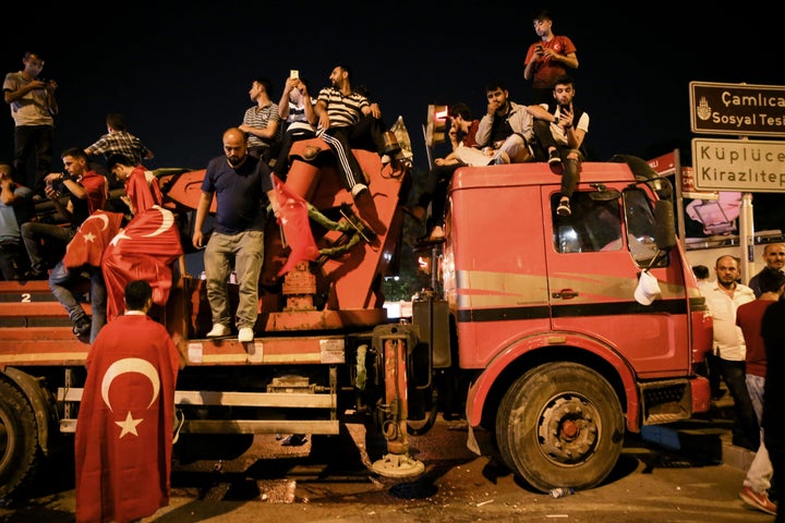 People gather in front of Turkish President Recep Tayyip Erdogan's residence at Kisikli Neighborhood in Istanbul, Turkey on J