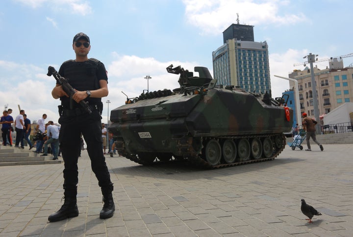 An abandoned tank is guarded at Taksim Square in Istanbul, Turkey, July 17, 2016.