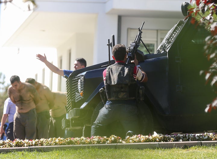 Turkish forces taken soldiers into custody at the Gendarmerie General Command's building in Ankara on July 16. Turkish officials say they have detained a least 6,000 in connection to Friday's coup attempt.