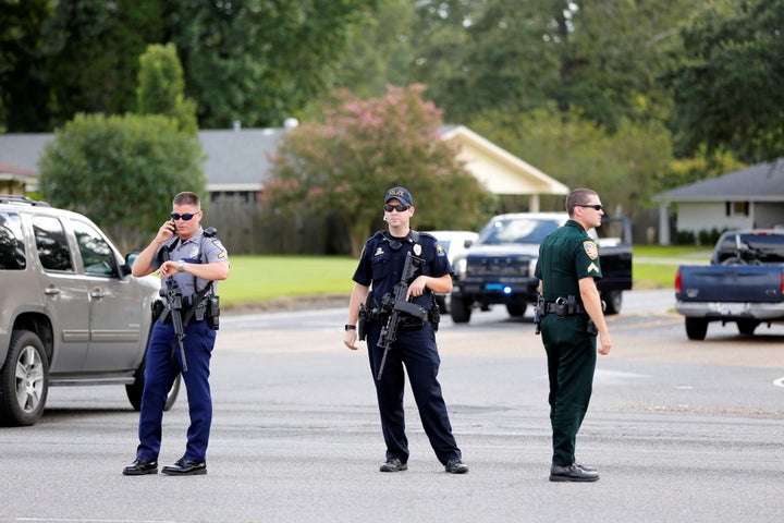 Police officers block off a road in Baton Rouge