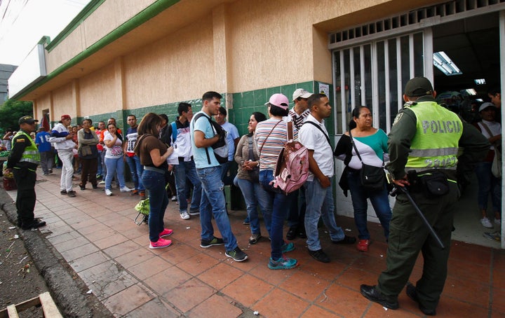 Venezuelans line up to buy at a supermarket in Cucuta, Colombia.