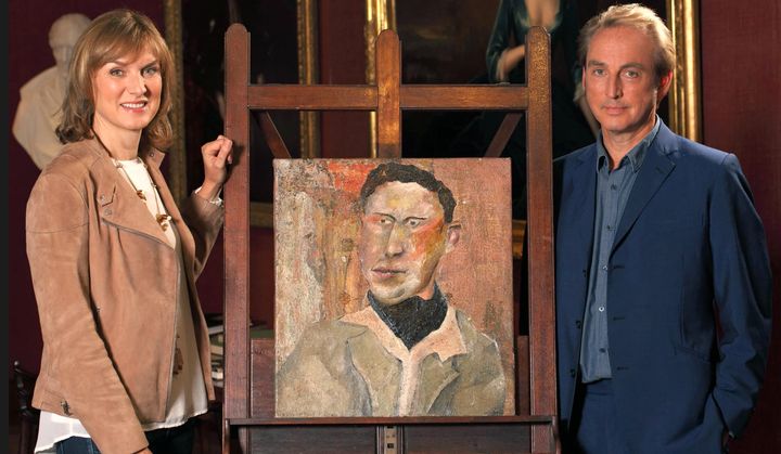 Fiona and Philip with the painting they sought to prove was by Lucian Freud