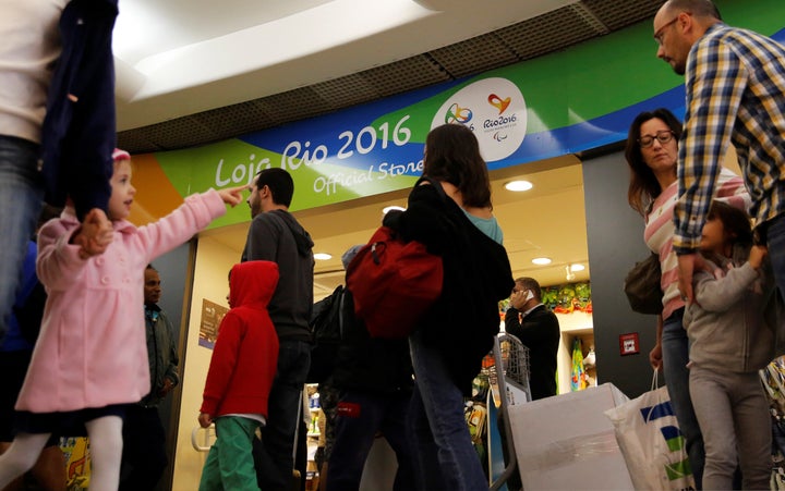 Passengers line up during a security check ahead of the 2016 Rio Olympics at Congonhas Airport in Sao Paulo, Brazil, July 18,