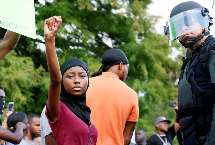 Demonstrators protest the shooting death of Alton Sterling near the headquarters of the Baton Rouge Police Department in Baton Rouge. 