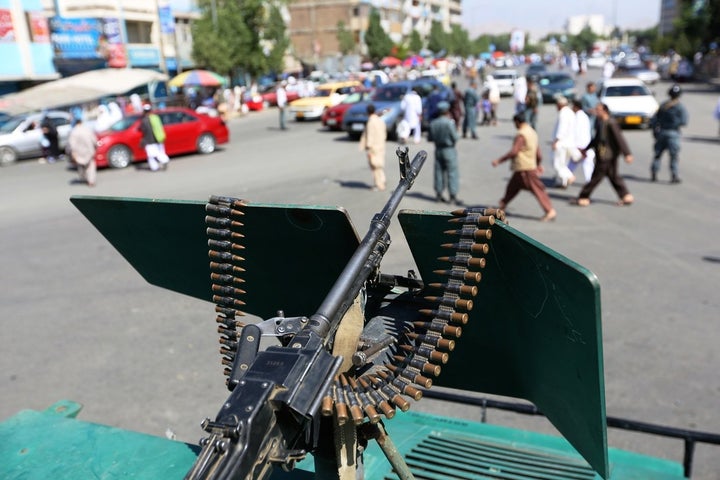 Security forces stand guard during the first day of Eid-al-Fitr outside a mosque in Kabul, Afghanistan. The capital remains in a fragile situation with Taliban forces closing in.