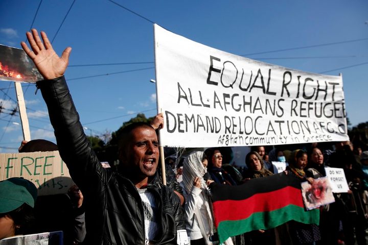 Afghan migrants chant slogans against the E.U.-Turkey agreement.