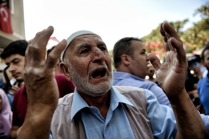 A Turkish man reacts during the July 18 funeral of police officer Erol Ince, killed in Friday's thwarted coup attempt, i