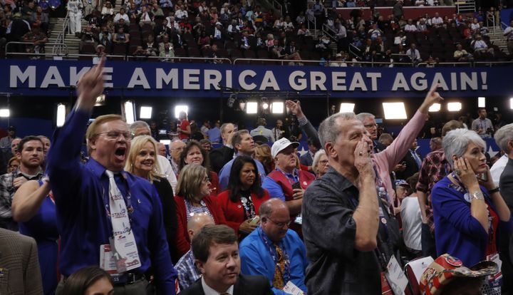 Republican National Convention delegates yell and scream as the Republican National Committee Rules Committee