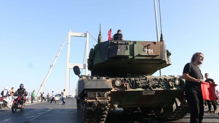 Turkish Police and supporters of Erdogan rally around military tanks on the Bosphorus Bridge where the Coup attempt started.
