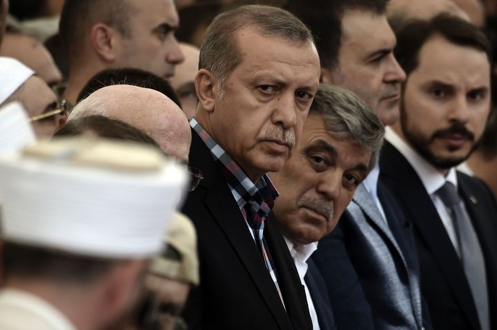 Erdogan and former Turkish President Abdullah Gul attend the funeral of a victim of the coup attempt in Istanbul on July 17, 2016.
