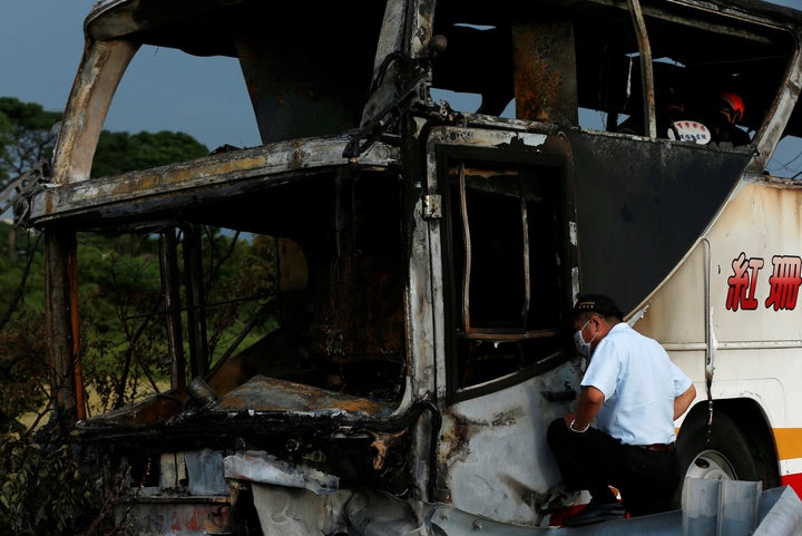 Twenty-six people died aboard a Taiwan tour bus that crashed into a highway railing on Tuesday.