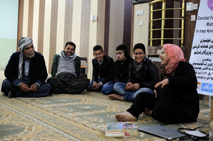 A social worker leads a discussion about FGM with men from Murtka village in Kurdistan, Iraq. In the region, more than 50 percent of girls and women aged 15 to 49 years have undergone FGM.