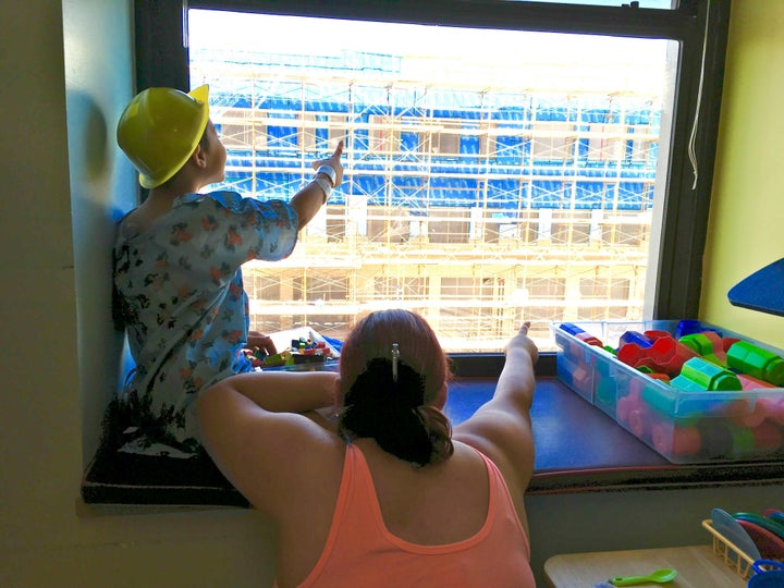 A patient and parent look for Waldo on the construction site.