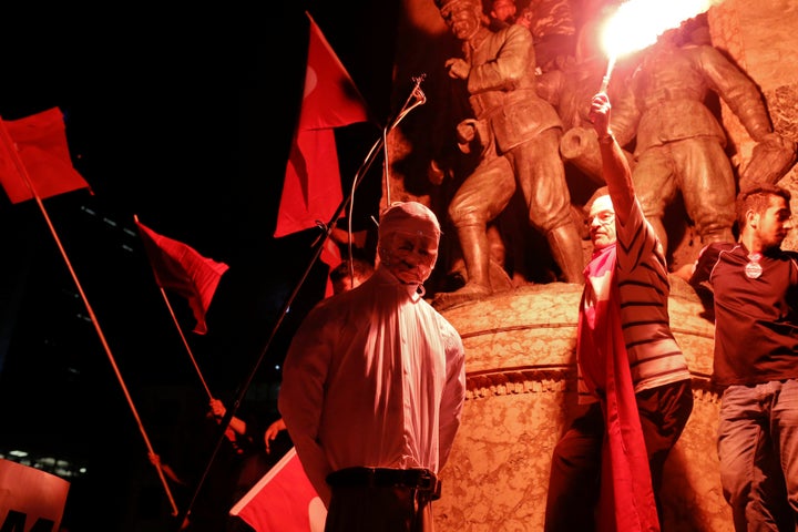 Supporters of Turkish President Recep Tayyip Erdogan hang an effigy of U.S.-based cleric Fethullah Gulen during a pro-government protest in Istanbul's Taksim Square on July 18.