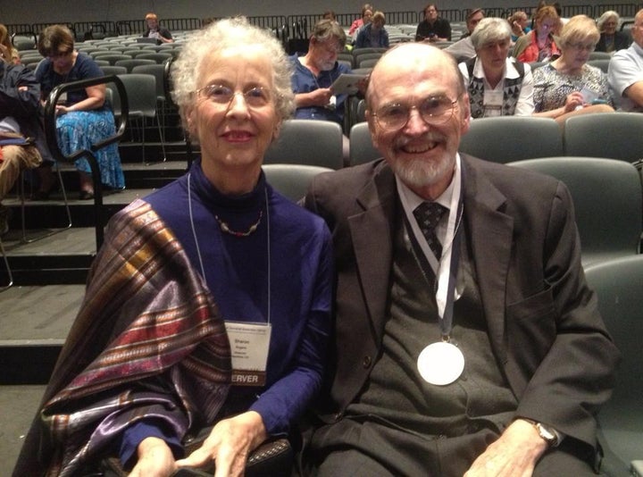 The Rev. Dr. Jack Rogers was presented with an Excellence in Theological Education Award at the 221st General Assembly of the Presbyterian Church (U.S.A.) in Detroit. Dr. Sharon Rogers, his wife, sits alongside him.