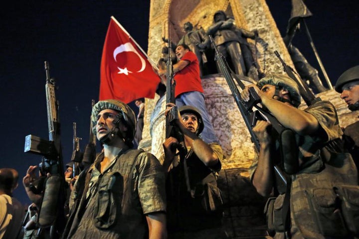 Turkish soldiers secure the area as supporters of President Recep Tayyip Erdogan protest in Istanbul's Taksim