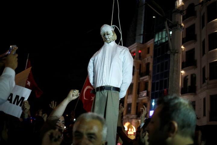 Supporters of Erdogan hold an effigy of U.S.-based cleric Fethullah Gulen hanged by a noose during a pro-government demonstra