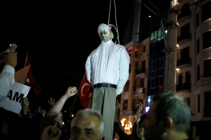Supporters of Erdogan hold an effigy of U.S.-based cleric Fethullah Gulen hanged by a noose during a pro-government demonstration on Taksim Square in Istanbul on July 18.
