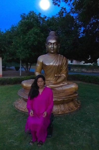 Vicky Lee meditating at Buddha Park on Campus 1, Oneness University, Chittoor District, Southern India.