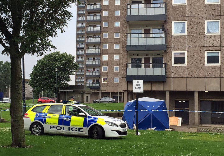 <strong>Police at the scene at Donside Court, Tillydrone, Aberdeen, where three people died following a disturbance.</strong>