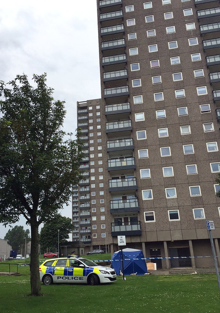 <strong>Police at the scene at Donside Court, Tillydrone, Aberdeen, where three people died following a disturbance.</strong>