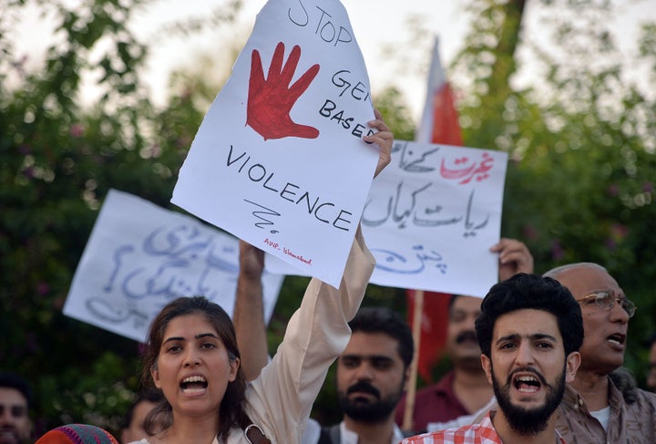 Pakistani civil society activists carry placards during a protest in Islamabad on July 18, 2016 against the murder of social media celebrity Qandeel Baloch by her own brother.