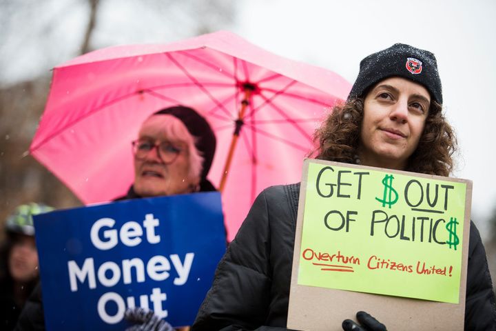 Drew Angerer / Getty Images | Danielle Greene, left, and Jennifer Vassil at a Washington rally.