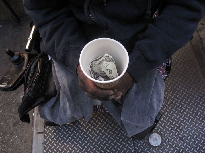 NEW YORK - OCTOBER 23: A homeless man who goes by the name Cleveland displays a cup containing money from panhandling on October 23, 2009 in New York City. In a recently released report by the advocacy group Coalition for the Homeless it was revealed that the numbers of homeless people using New York City shelters each night has reached an all time high. Since Mayor Michael Bloomberg took office eight years ago there has been a 45 percent increase in shelter use with over 39,000 homeless people, including 10,000 homeless families, checking in to city shelters every evening. The group also said that 2009 has turned out to be 'the worst on record for New York City homelessness since the Great Depression. (Photo by Spencer Platt/Getty Images)