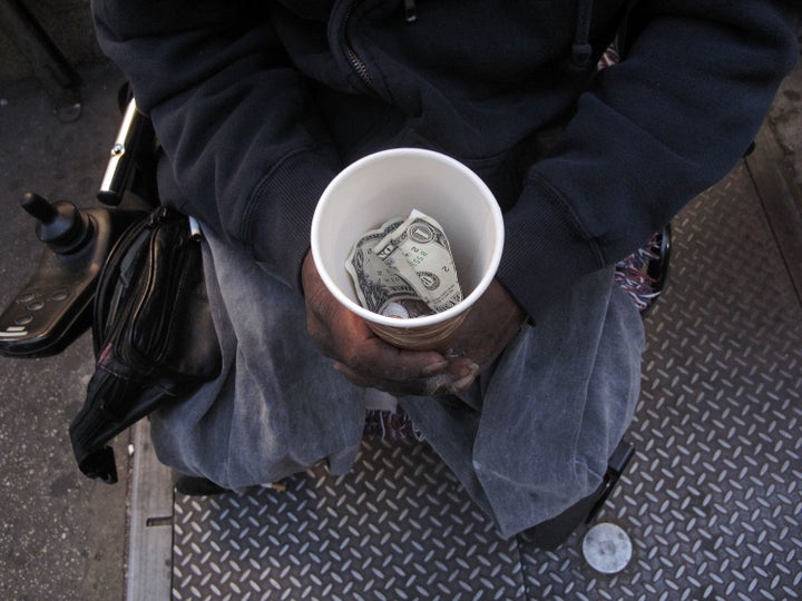 NEW YORK - OCTOBER 23: A homeless man who goes by the name Cleveland displays a cup containing money from panhandling on October 23, 2009 in New York City. In a recently released report by the advocacy group Coalition for the Homeless it was revealed that the numbers of homeless people using New York City shelters each night has reached an all time high. Since Mayor Michael Bloomberg took office eight years ago there has been a 45 percent increase in shelter use with over 39,000 homeless people, including 10,000 homeless families, checking in to city shelters every evening. The group also said that 2009 has turned out to be 'the worst on record for New York City homelessness since the Great Depression. (Photo by Spencer Platt/Getty Images)