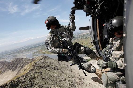 Staff Sgt. Spraktes preparing to be lowered down the hoist. Photo courtesy of Capt. William Martin, California Army National Guard