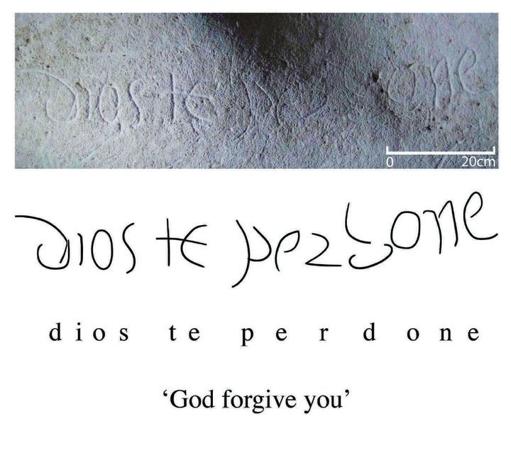 One of several inscriptions found in the cave is seen here.