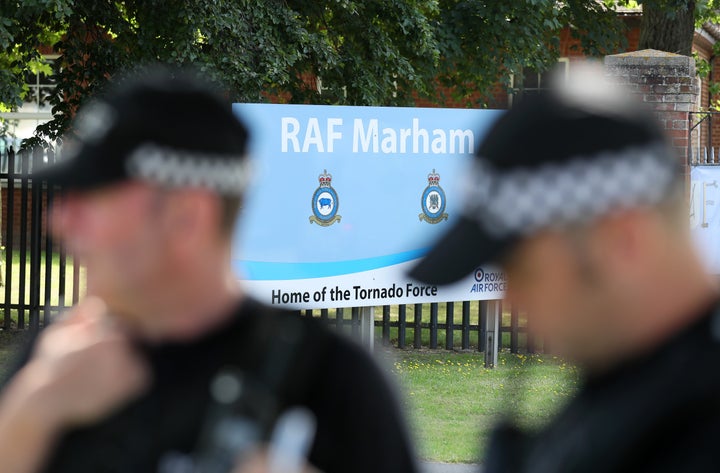 Police outside RAF Marham in Norfolk, after a serviceman was threatened with a knife near to the base.