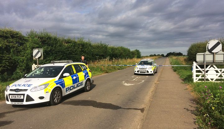 Police are hunting two men after a serviceman was threatened with a knife in Norfolk.