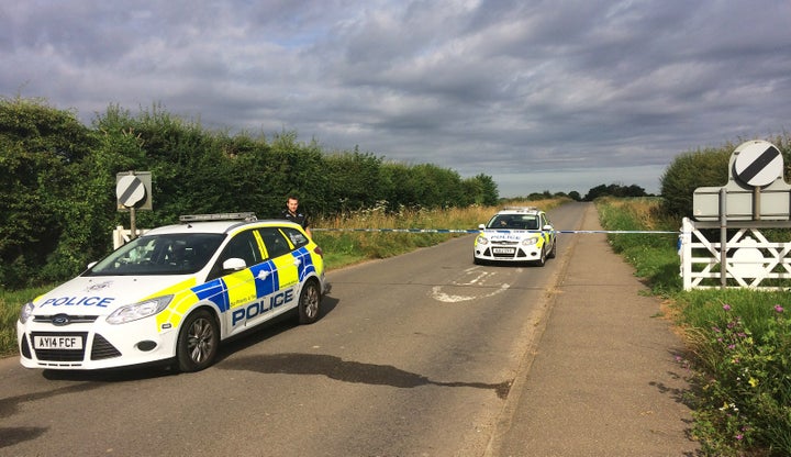 Police are hunting two men after a serviceman was threatened with a knife in Norfolk.