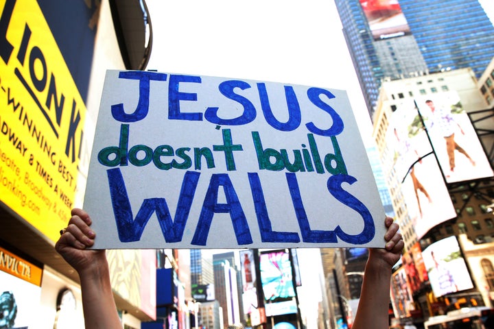 A group of interfaith religious leaders protest against Republican U.S. presidential candidate Donald Trump outside a hotel where he was to meet with evangelical leaders in New York City, U.S., June 21, 2016.