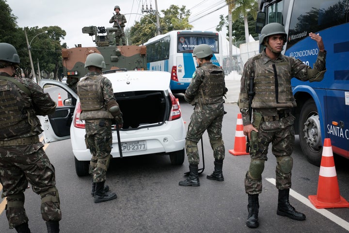 Brazilian soldiers man a checkpoint on a street near the Olympic Village in Rio de Janeiro on Thursday.