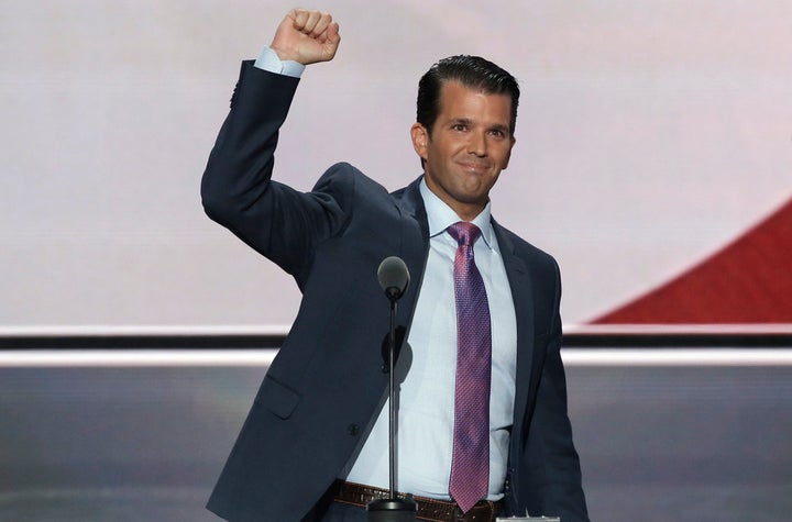 Donald Trump Jr. pumps his fist after speaking about his father, Republican U.S. presidential nominee Donald Trump, during th
