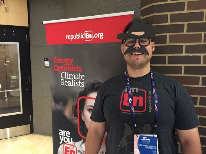 Alex Bozmoski, director of strategy and operations at RepublicEn, wears the Teddy Roosevelt mask his group distributed at the Republican National Convention. His group was one of several "eco-right" organizations represented in Cleveland.