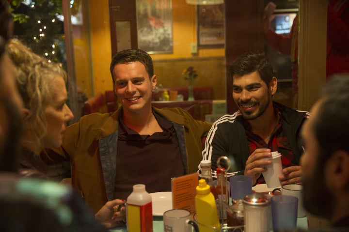 Groff (left) shares a cozy moment with co-star Raúl Castillo.