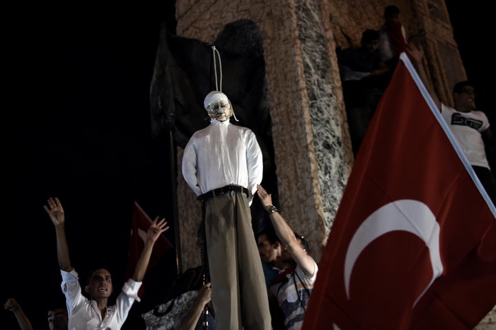 Pro-Erdogan supporters hang an effigy of U.S.-based preacher Fethullah Gulen at rally at Taksim Square in Istanbul on July 18. The country's president has blamed Gulen for helping inspire the coup attempt, and some Turks want the death penalty reinstated for coup perpetrators.